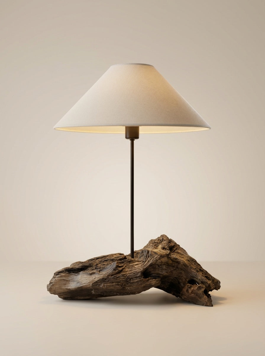 Untreated Organic Root Lamp This enchanting lamp is a celebration of nature's artistry. The sculptural raw wood base, left
