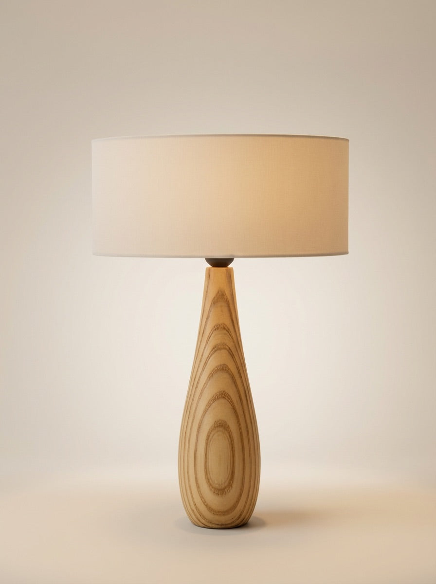 Modern Teardrop Wood Table Lamp This elegant table lamp features a handcrafted, teardrop-shaped base made from solid wood,